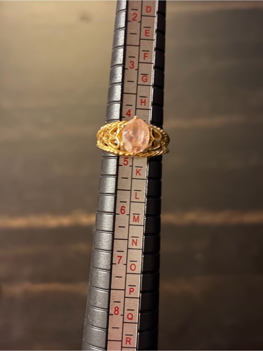 Gold filigree ring with pink stone